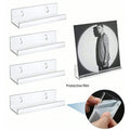 Clear acrylic wall display shelf mounted on a wall