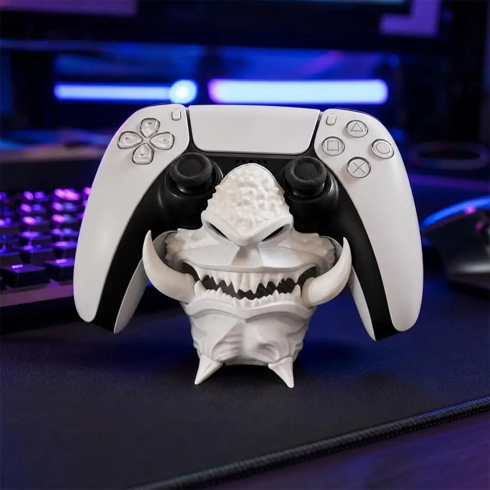 Bone-white 3D-printed oni mask stand with a PS5 DualSense controller seated in the shaped groove, angled view