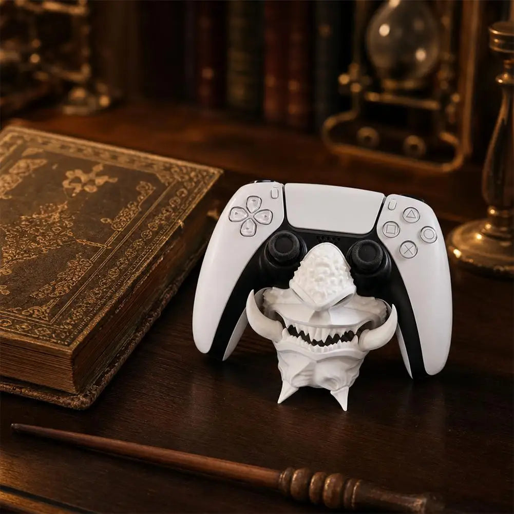 Bone-white 3D-printed oni mask stand with a PS5 DualSense controller seated, close-up angled view