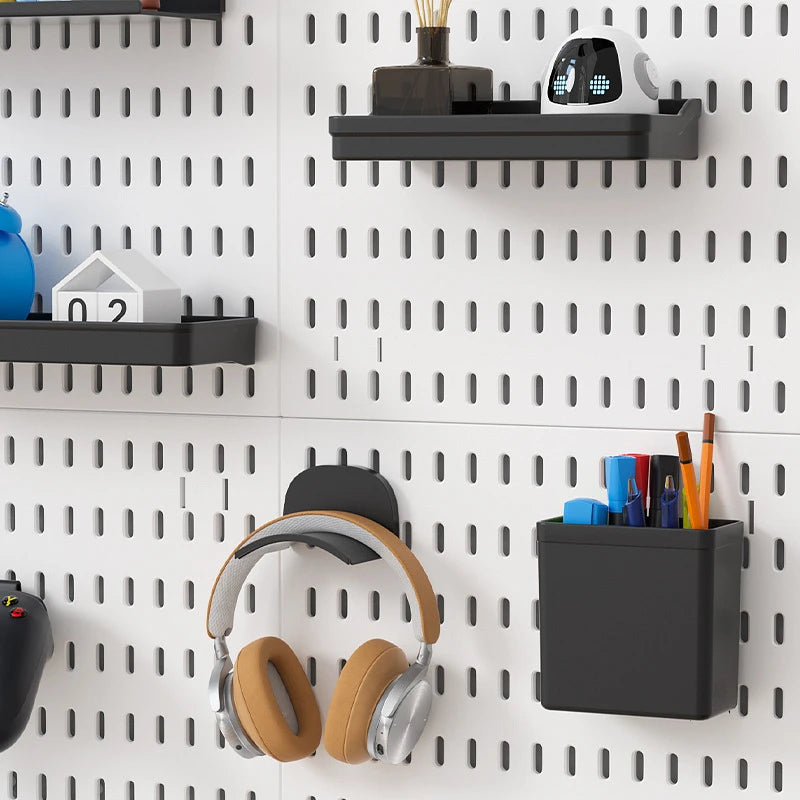 Two white pegboard panels arranged side by side holding small items; this listing includes one panel only, accessories sold separately